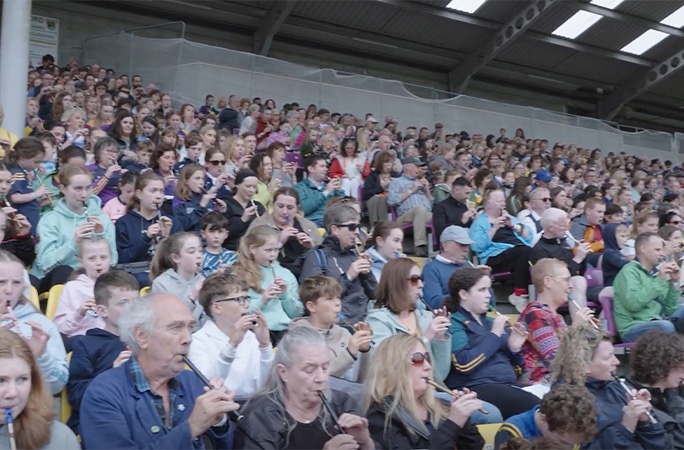 people playing the tin whistle