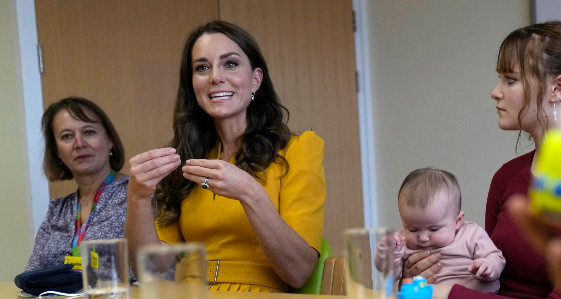 Kate Middleton wears a yellow dress to visit the Royal Surrey County Hospital's Maternity Unit on October 5, 2022