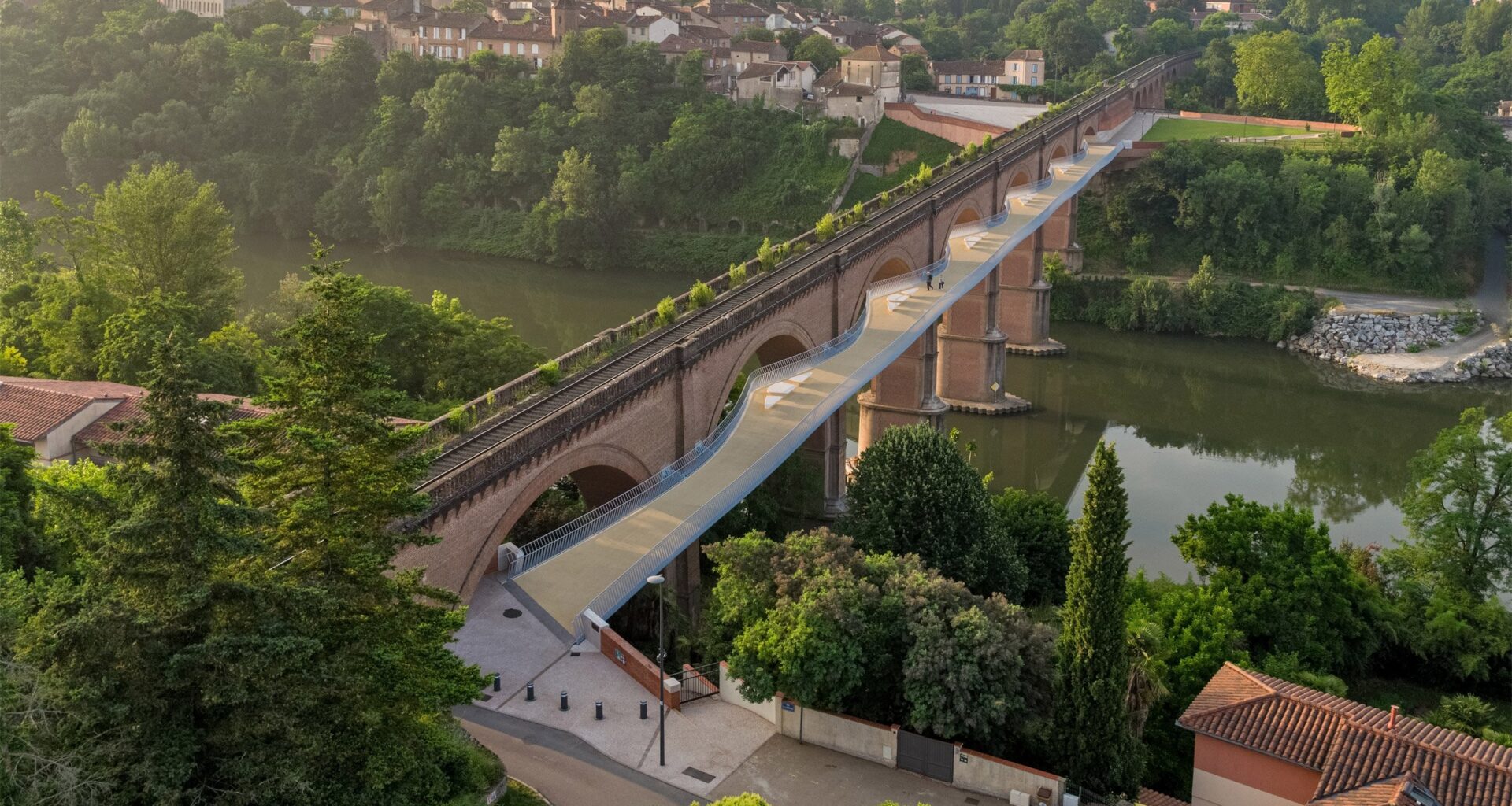 Ney and Partners curves footbridge between arches of French viaduct