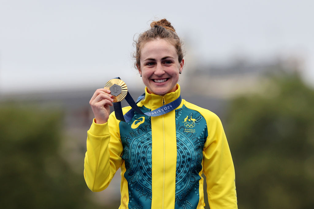 Gold medalist Grace Brown of Team Australia poses on the podium during the Women's Individual Time Trial on day one of the Olympic Games Paris 2024 at Pont Alexandre III on July 27, 2024 in Paris, France. (Photo by Tim de Waele/Getty Images)