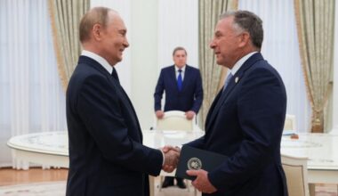 The two men are shaking hands