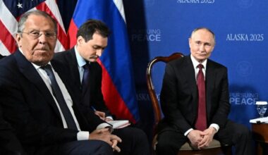 Russian foreign minister Sergei Lavrov, left, with Vladimir Putin, right, in Alaska