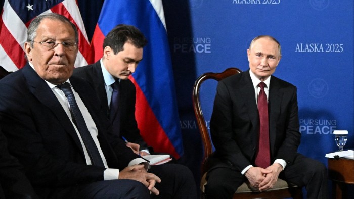 Russian foreign minister Sergei Lavrov, left, with Vladimir Putin, right, in Alaska
