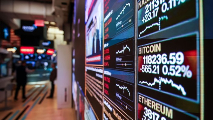 Cryptocurrency market information on a TV screen on the floor of the New York Stock Exchange