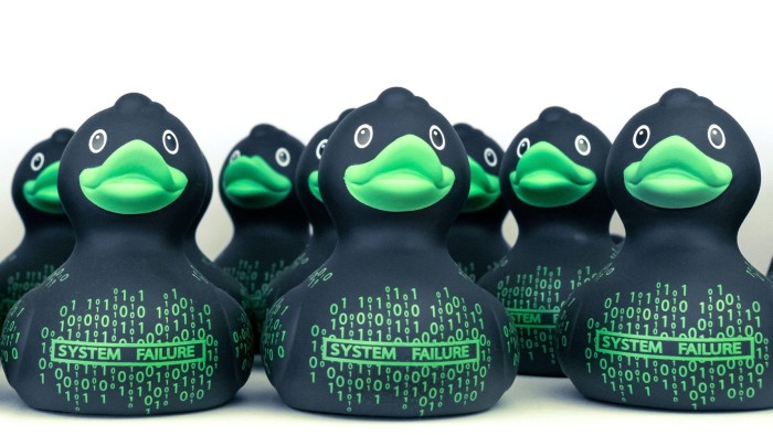 A row of rubber ducks. Some developers say AI is best used as a way to talk through coding problems, a technique they call rubber ducking (after their habit of talking to the toys on their desk)