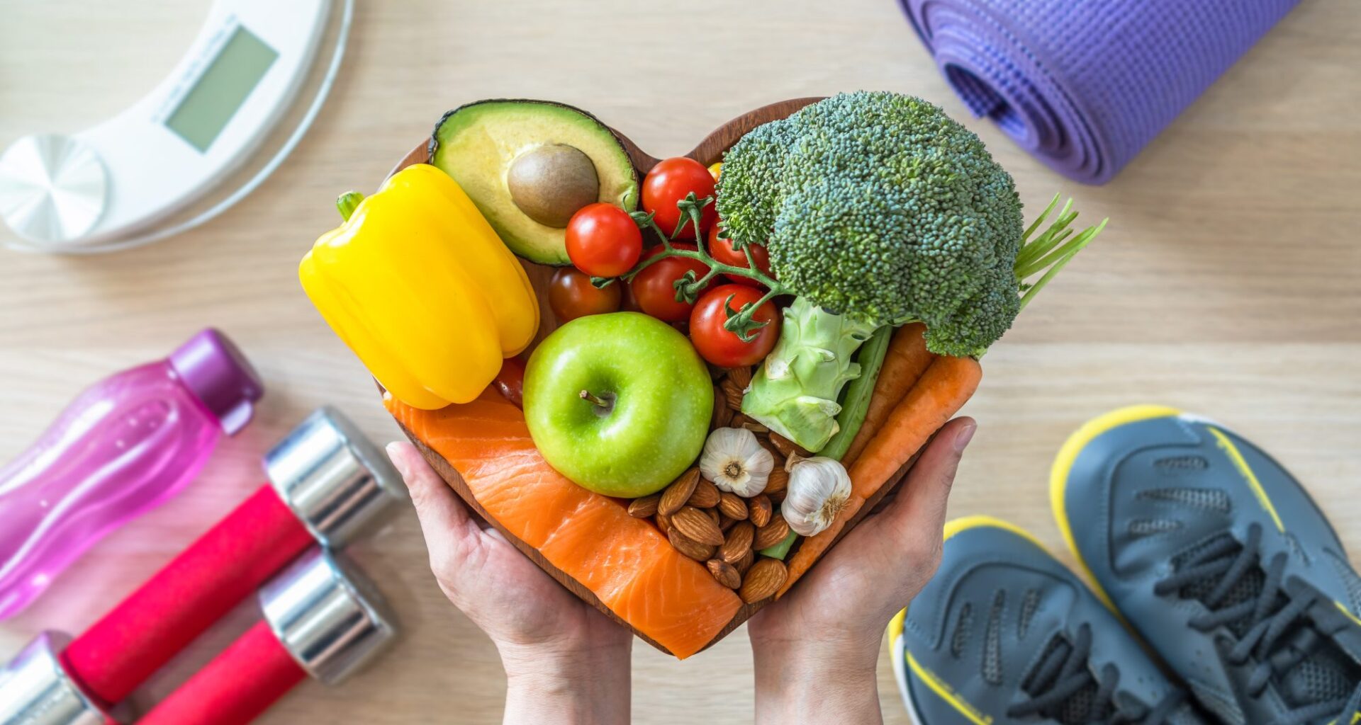 Healthy lifestyle on ketogenic diet, eating clean keto food good health dietary in heart dish with aerobic body exercise, gym workout training class , weight scale and sports shoes in fitness center