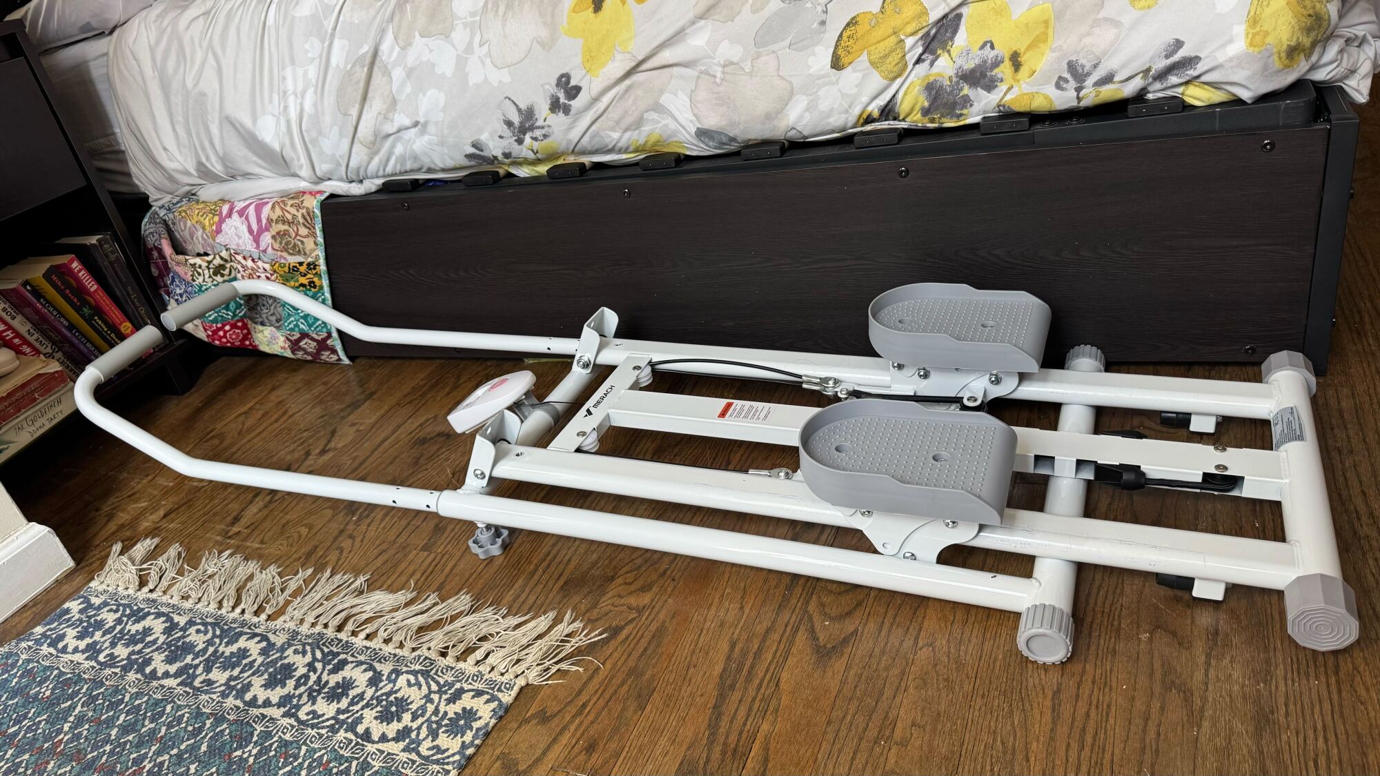 Merach stair stepper by bed