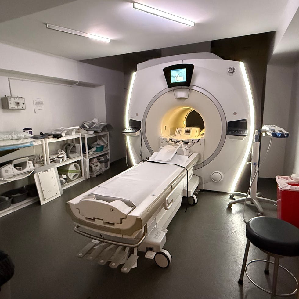 mri room with scanning machine and medical equipment
