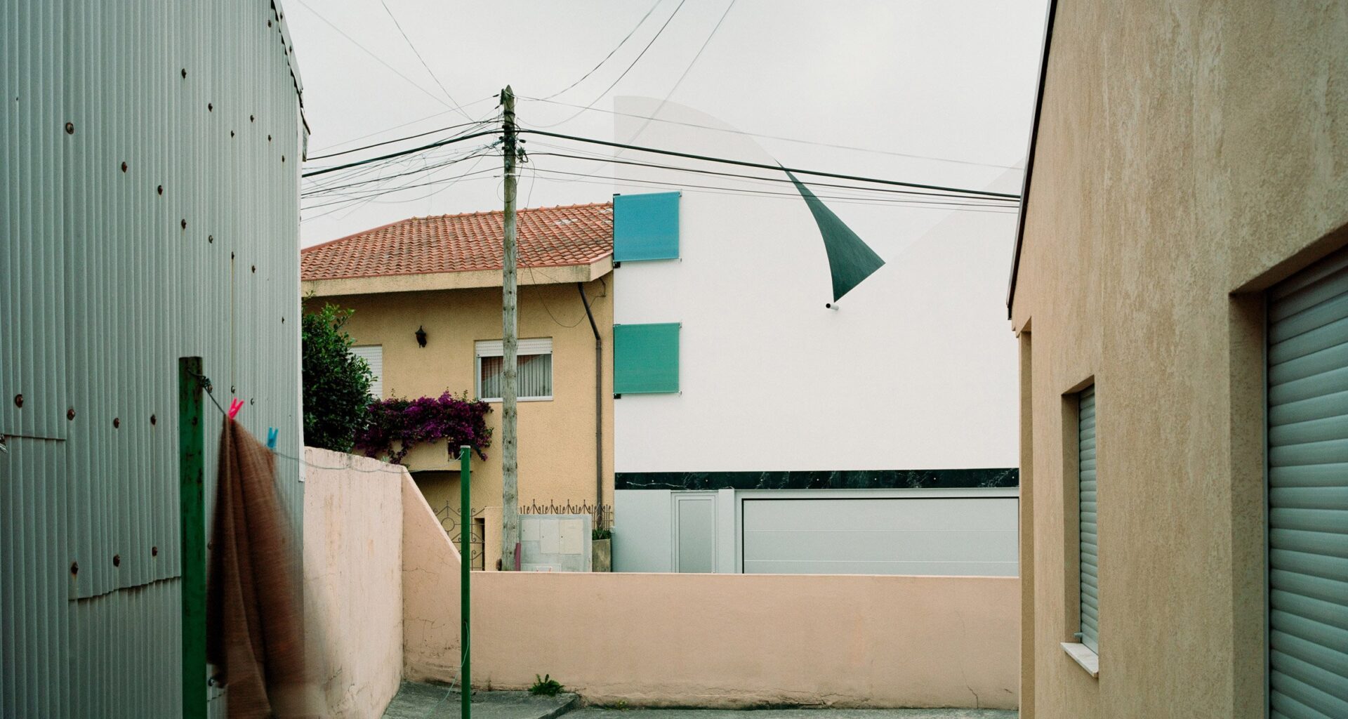 A House with an Inverted Roof by Fala Atelier