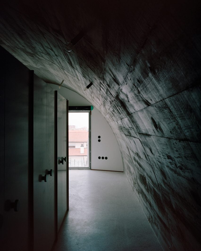 Barrel-vaulted interior of Porto home by Fala Atelier