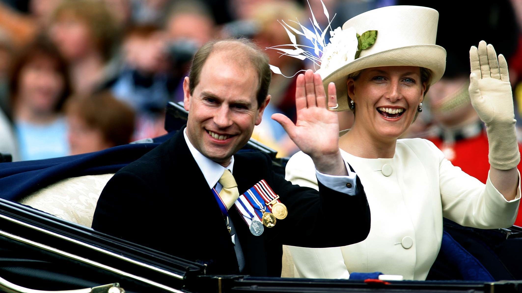 Prince Edward and Sophie, Duchess of Edinburgh, wave from their carriage as it departs from Buckingham Palace in 2002