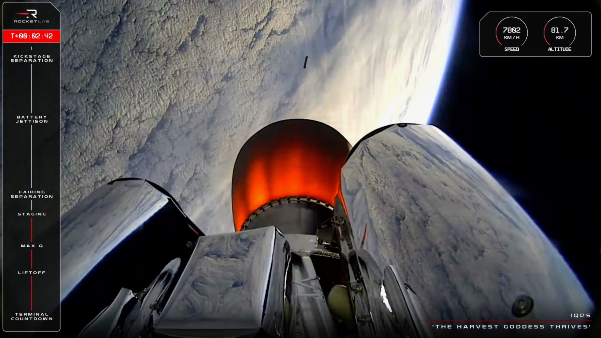 view from a rocket high above earth, showing an orange-hot nozzle with earth in the background