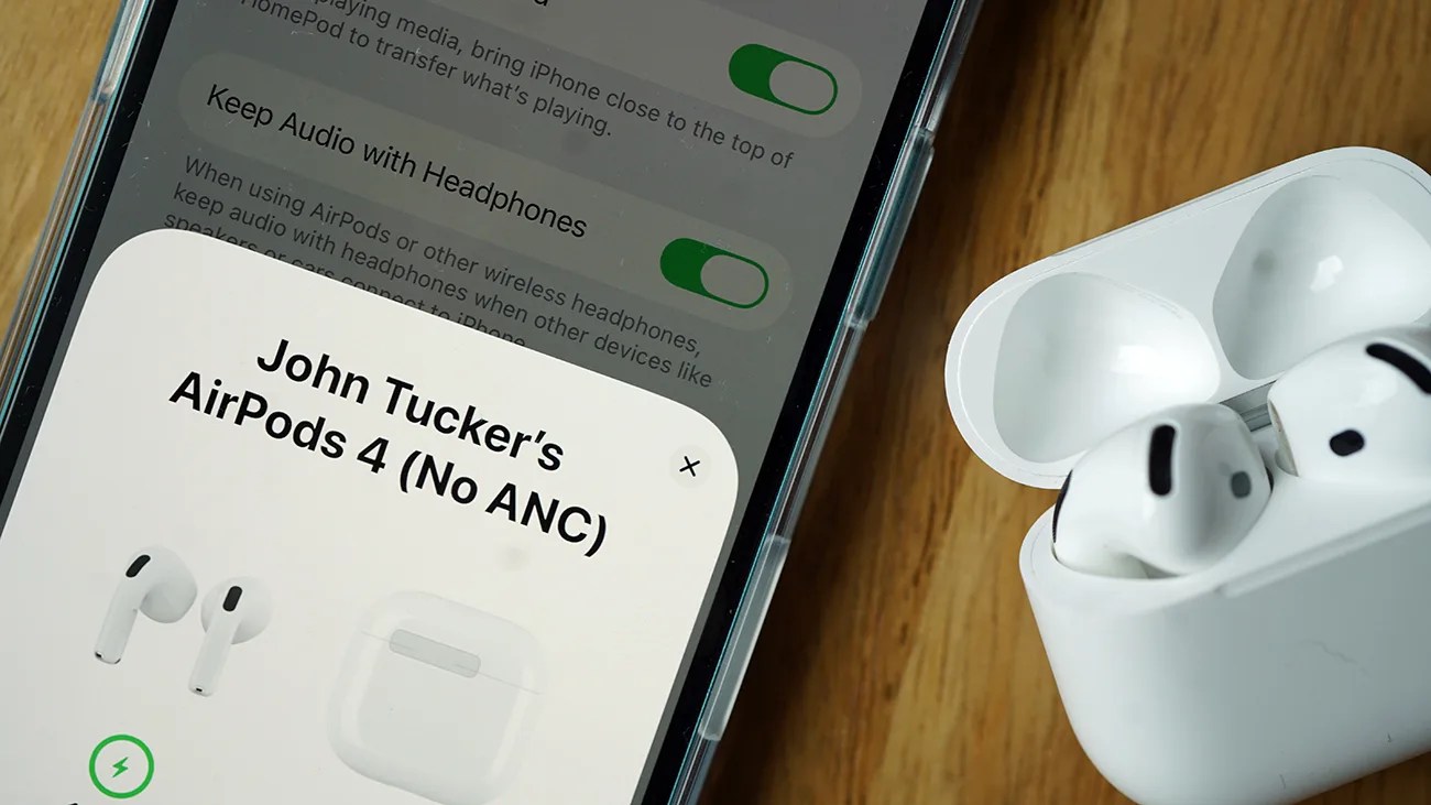 A close-up of a smartphone screen showing a Bluetooth connection to "John Tucker