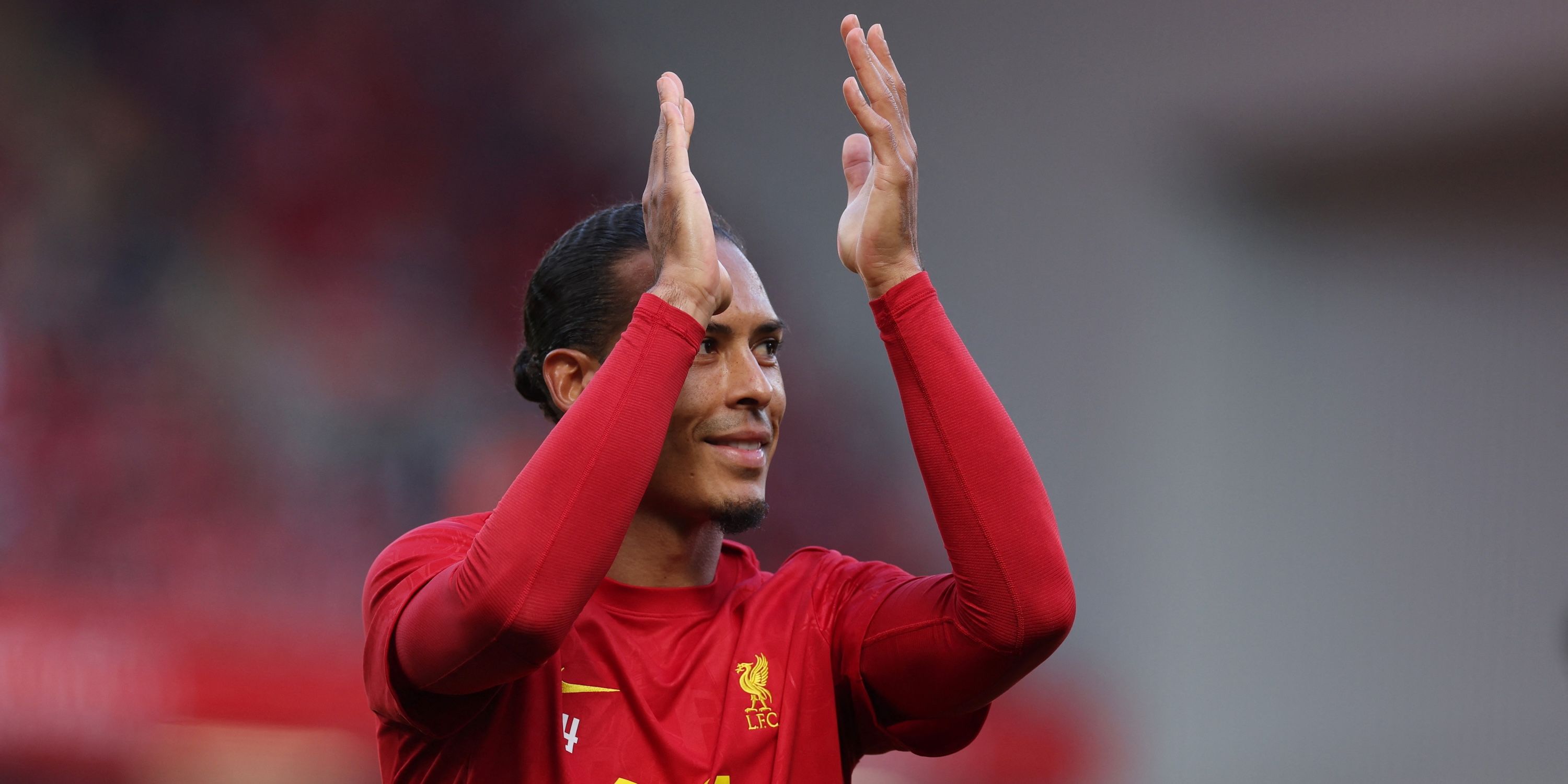 Liverpool's Virgil van Dijk applauds fans before the match