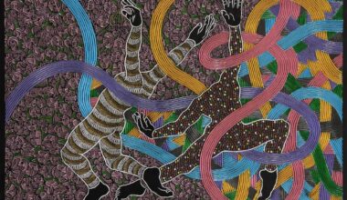 An abstract painting carved from wood with geometric patterns and two headless figures.