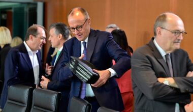German Chancellor Friedrich Merz (C) arrives for the weekly meeting of the cabinet at the Chancellery in Berlin on August 6, 2025.