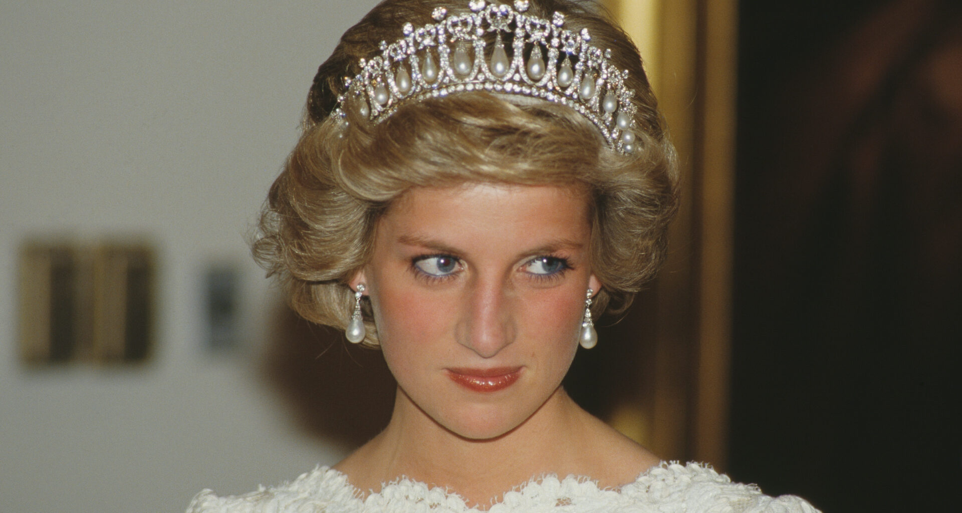 Princess Diana wears a white lace bateau neck dress with the Spencer Tiara
