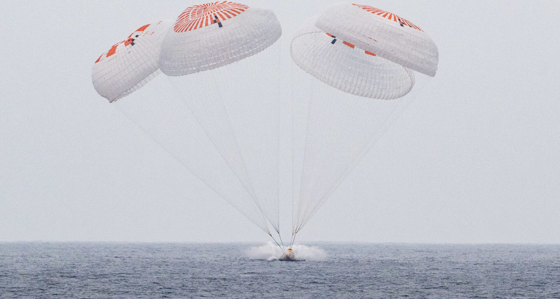 The SpaceX Crew Dragon Endurance spacecraft is seen as it lands with NASA astronauts Anne McClain and Nichole Ayers, JAXA (Japan Aerospace Exploration Agency) astronaut Takuya Onishi, and Roscosmos cosmonaut Kirill Peskov aboard in the Pacific Ocean off the coast of San Diego, Calif., Saturday, Aug. 9, 2025. McClain, Ayers, Onishi, and Peskov are returning after seven-months in space as part of Expedition 73 aboard the International Space Station.