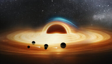 An artist's rendering of a supermassive black hole with two smaller black holes merging as they orbit it