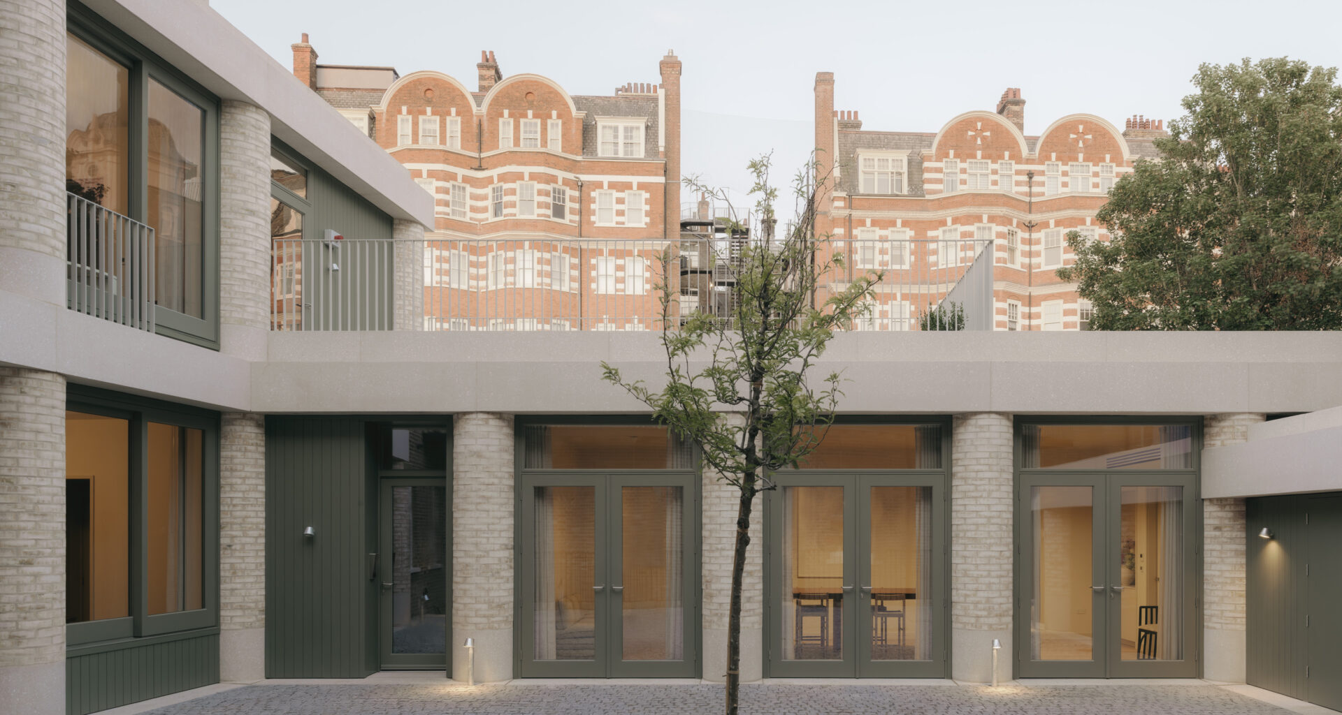 20 Newcourt Street, by Wendover, a london development of old and new with round columns and brick frontage