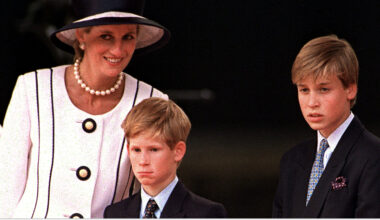 Princess Diana wears a white suit and matching hat with black piping, and poses with her sons Prince Harry and Prince William