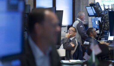 Stocks close mixed as Dow just misses a record high