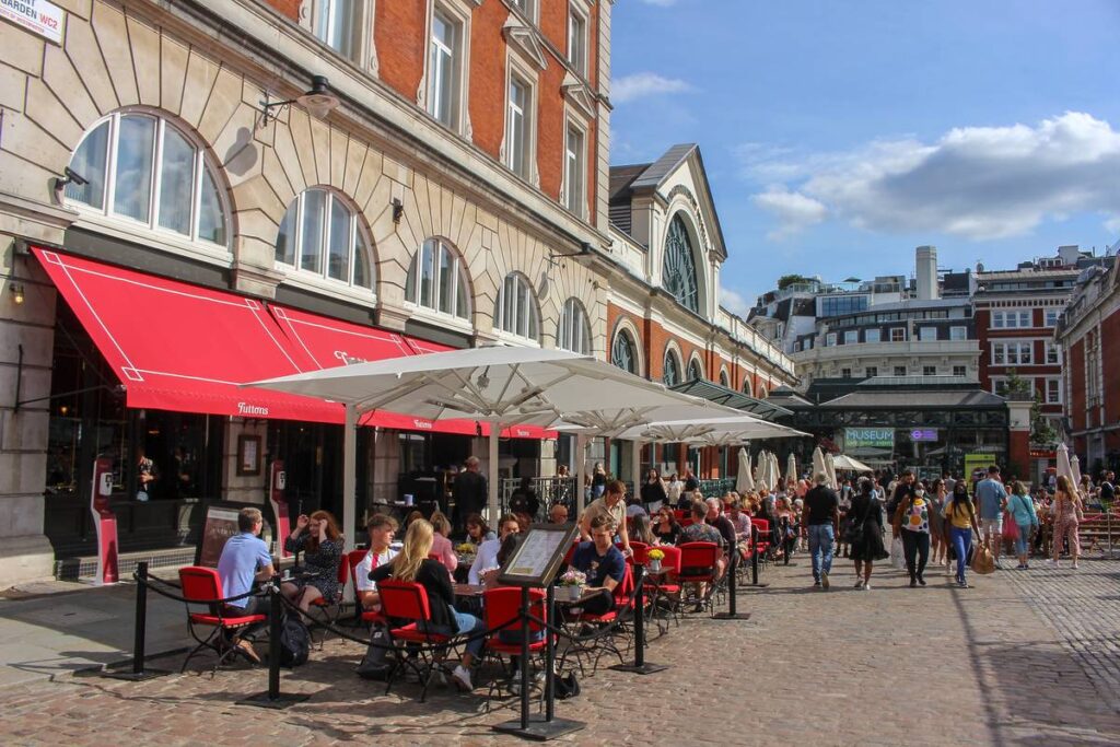 People dining outdoors in Covent Garden