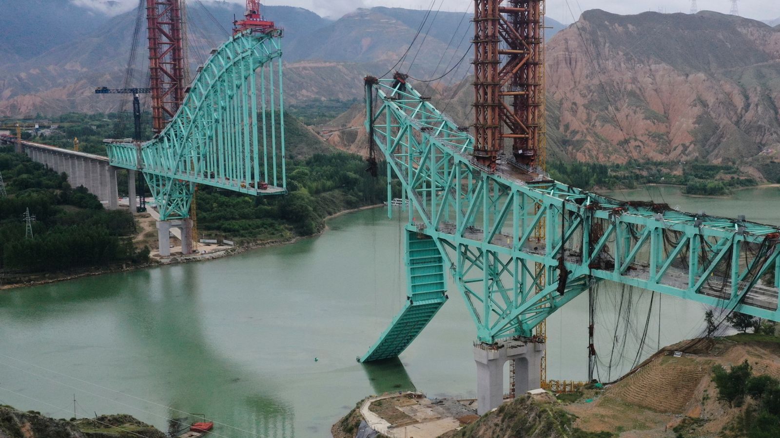 Multiple people are dead after a bridge collapsed on the Qinghai section of the Sichuan-Qinghai Railway. Pic: Li Zhanyi/Xinhua/AP