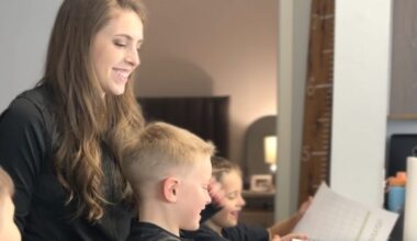 Jonah, middle, flicks through a financial planner with mum Samantha