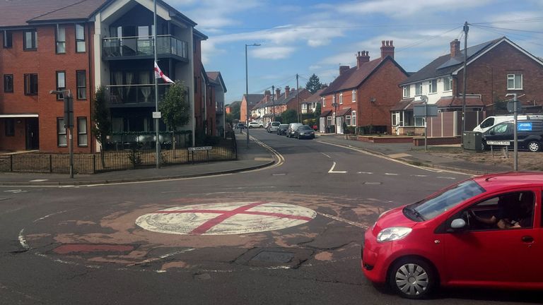A mini roundabout painted in the colours of St George's flag in Bromsgrove. Pic: Reuters