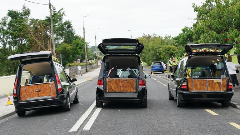 The three hearses outside the funeral for Vanessa Whyte and her children Sara and James Rutledge. Pic: Noel Sweeney/PA
