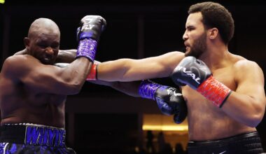 Moses Itauma punches Dillian Whyte during the WBO Inter-Continental Heavyweight title fight