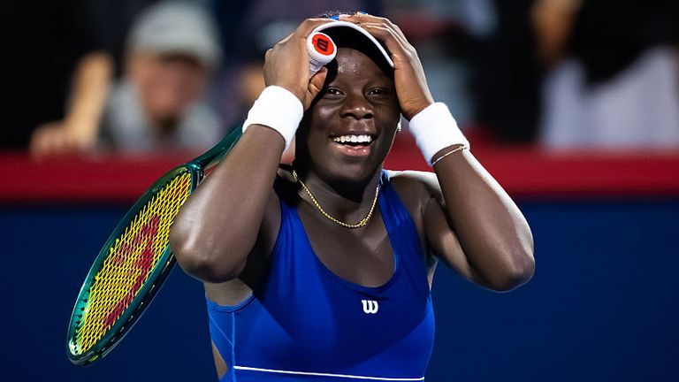 Canada's Victoria Mboko puts her hands on her head in disbelief and celebration after defeating top seed Coco Gauff in Montreal