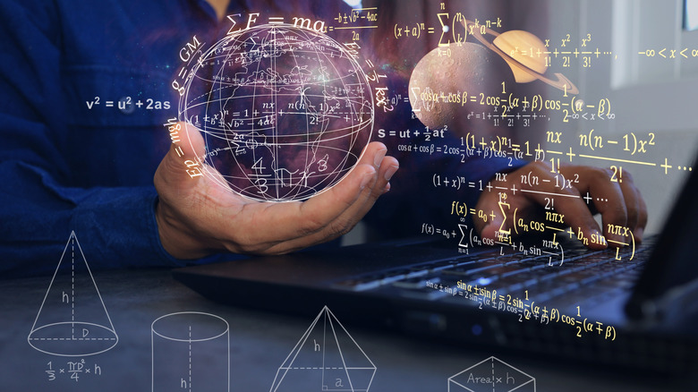concept of a world and mathematics forming, hovering over a laptop