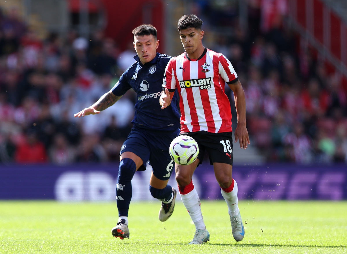 Mateus Fernandes of Southampton is put under pressure by Lisandro Martinez of Manchester United