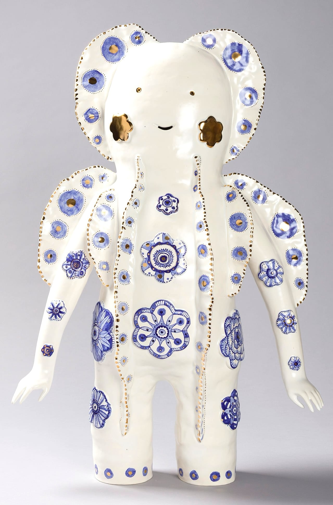 a white figure with patterns on its body