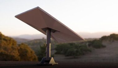 A Starlink satellite dish sits in the foreground, angled at 30 degrees, while hills and mountains dotted with green tees sit in the unfocused background