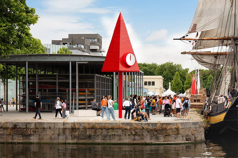 studio 5•5 rises 101st spire in caen as a glowing red monument to the city's millennium