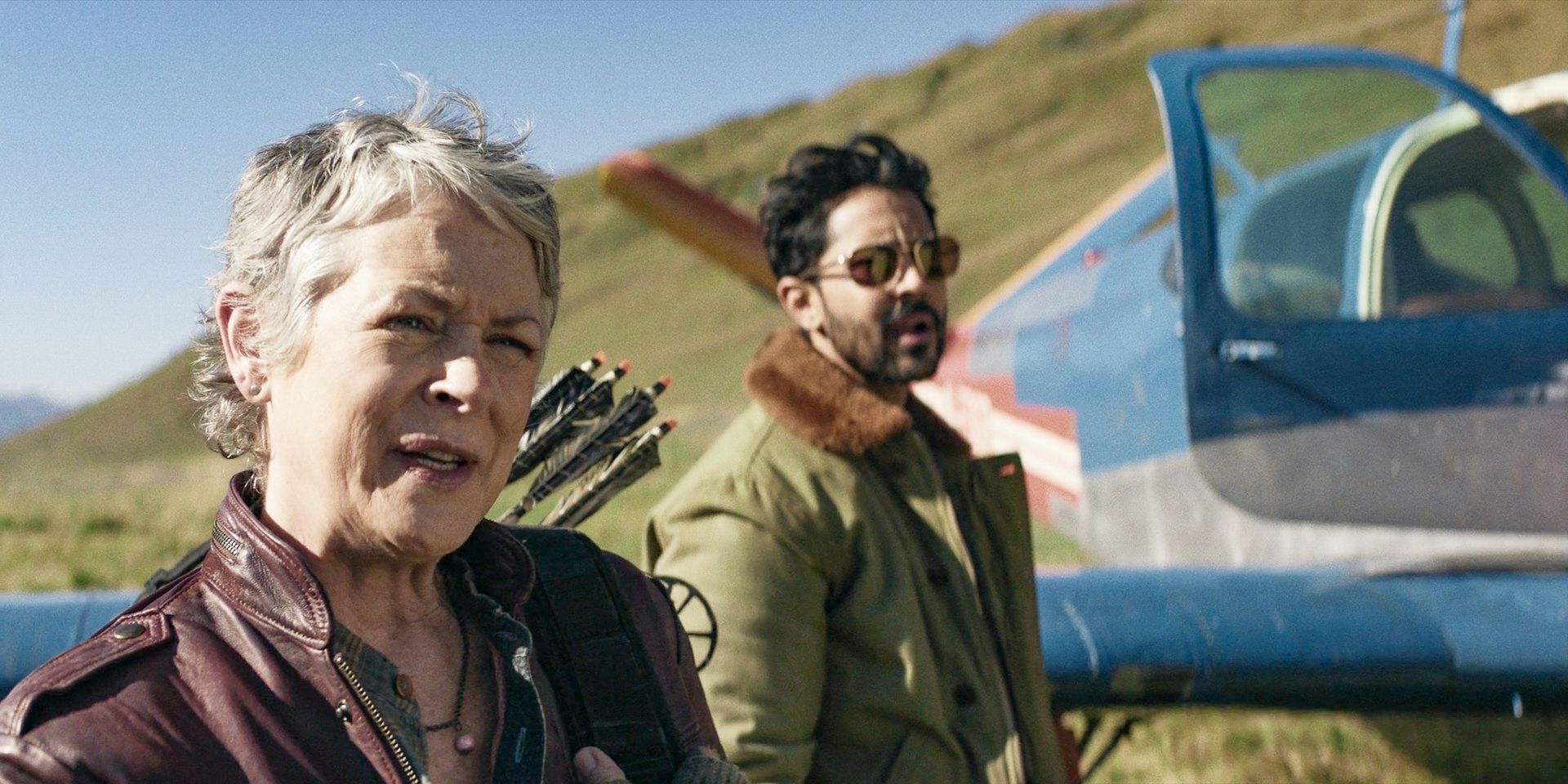 Carol (Melissa McBride) and Ash (Manish Dayal) landing in Greenland in The Walking Dead: Daryl Dixon.