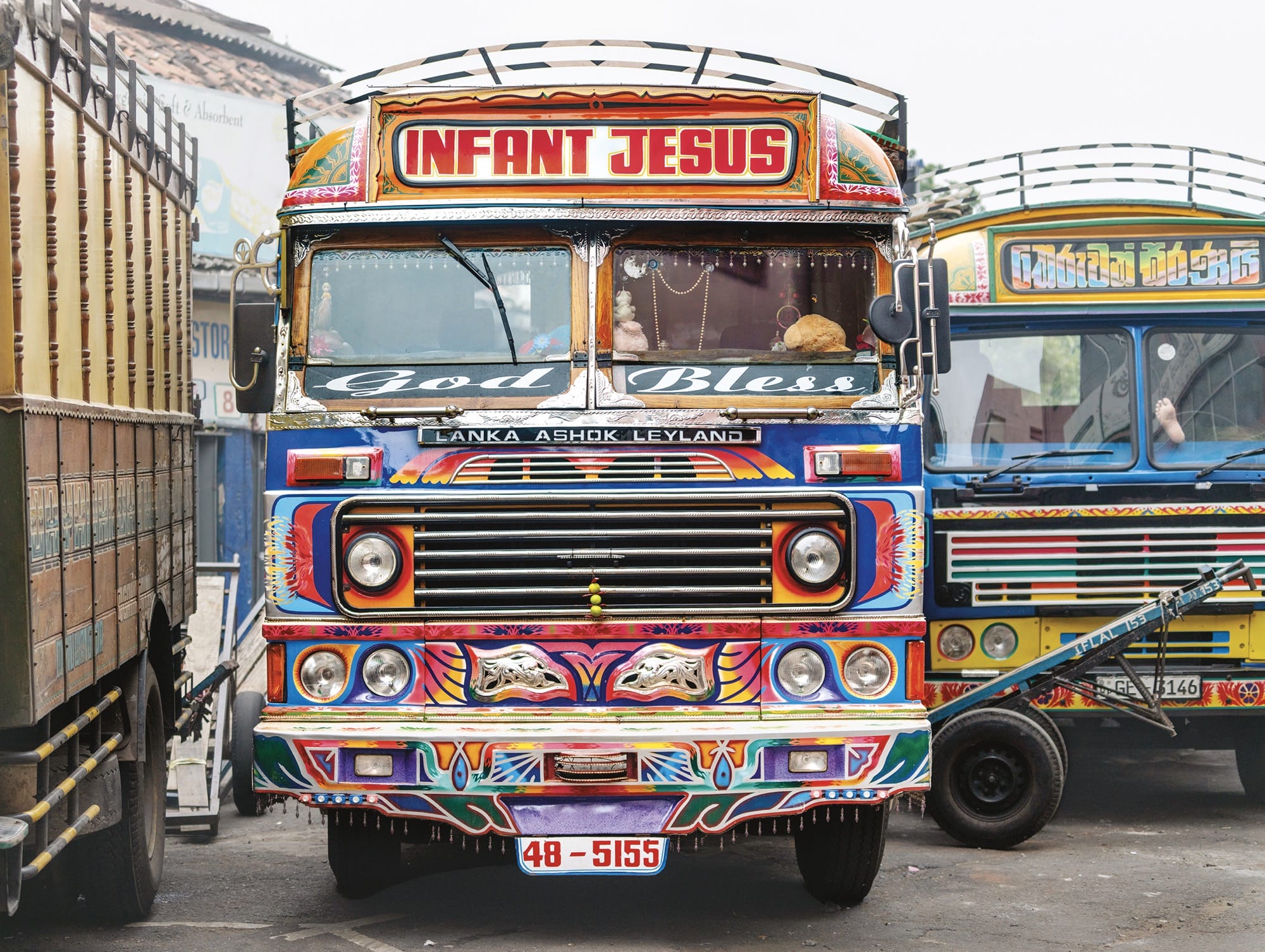 a colorfully painted truck with the words "infant jesus" at the top