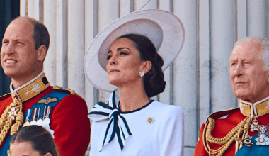 Prince William and King Charles wear military uniform as they stand on the Buckingham Palace balcony with Kate Middleton, who wears a white dress with navy accents