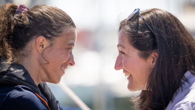 Jazz Turner and Hannah Stodel share a poignant moment at the circumnavigation finish. Photo credit: Fergus Kennedy