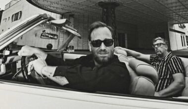 The Black Keys posing in a convertable car