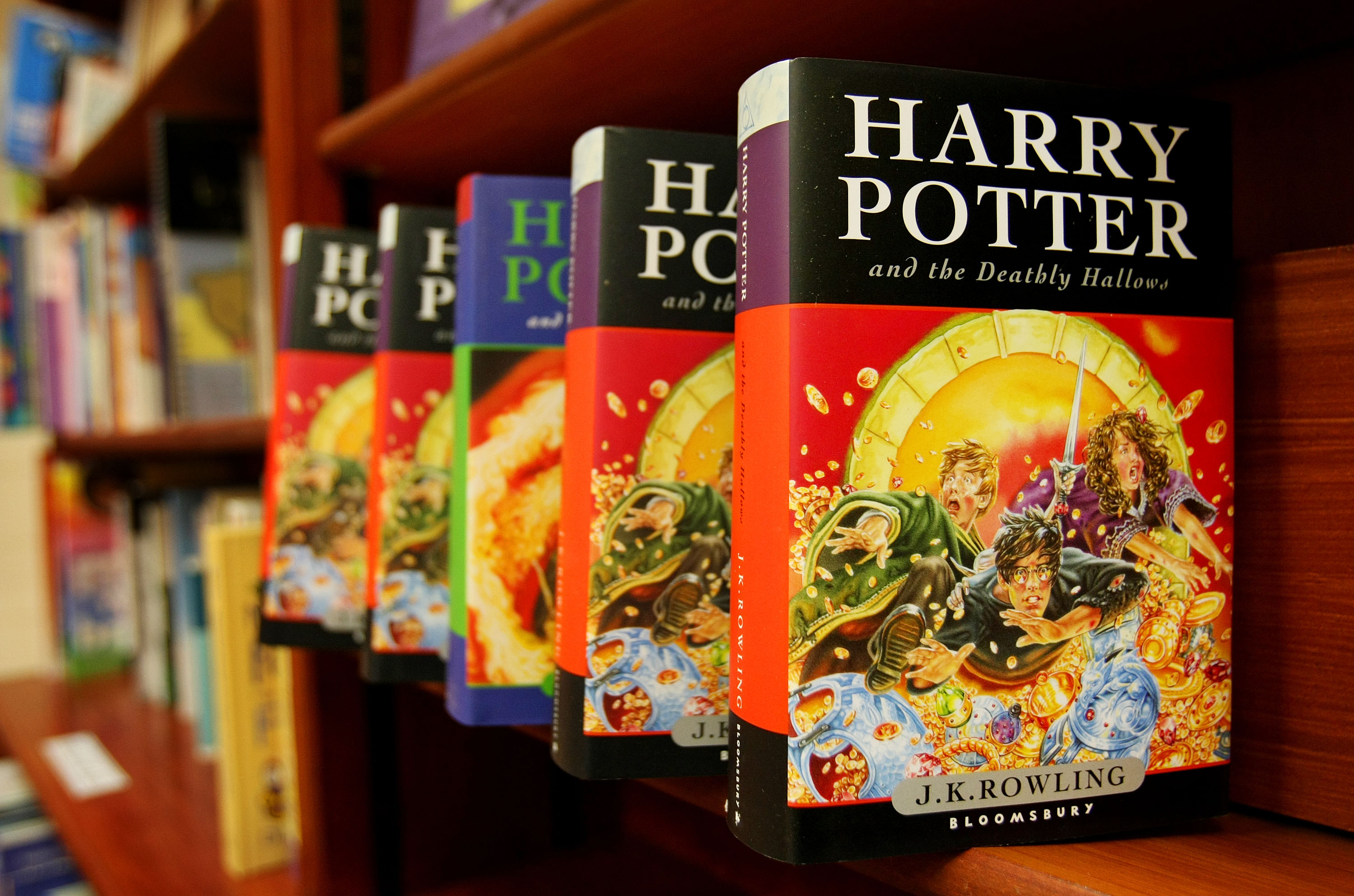 Harry Potter books on a shelf.