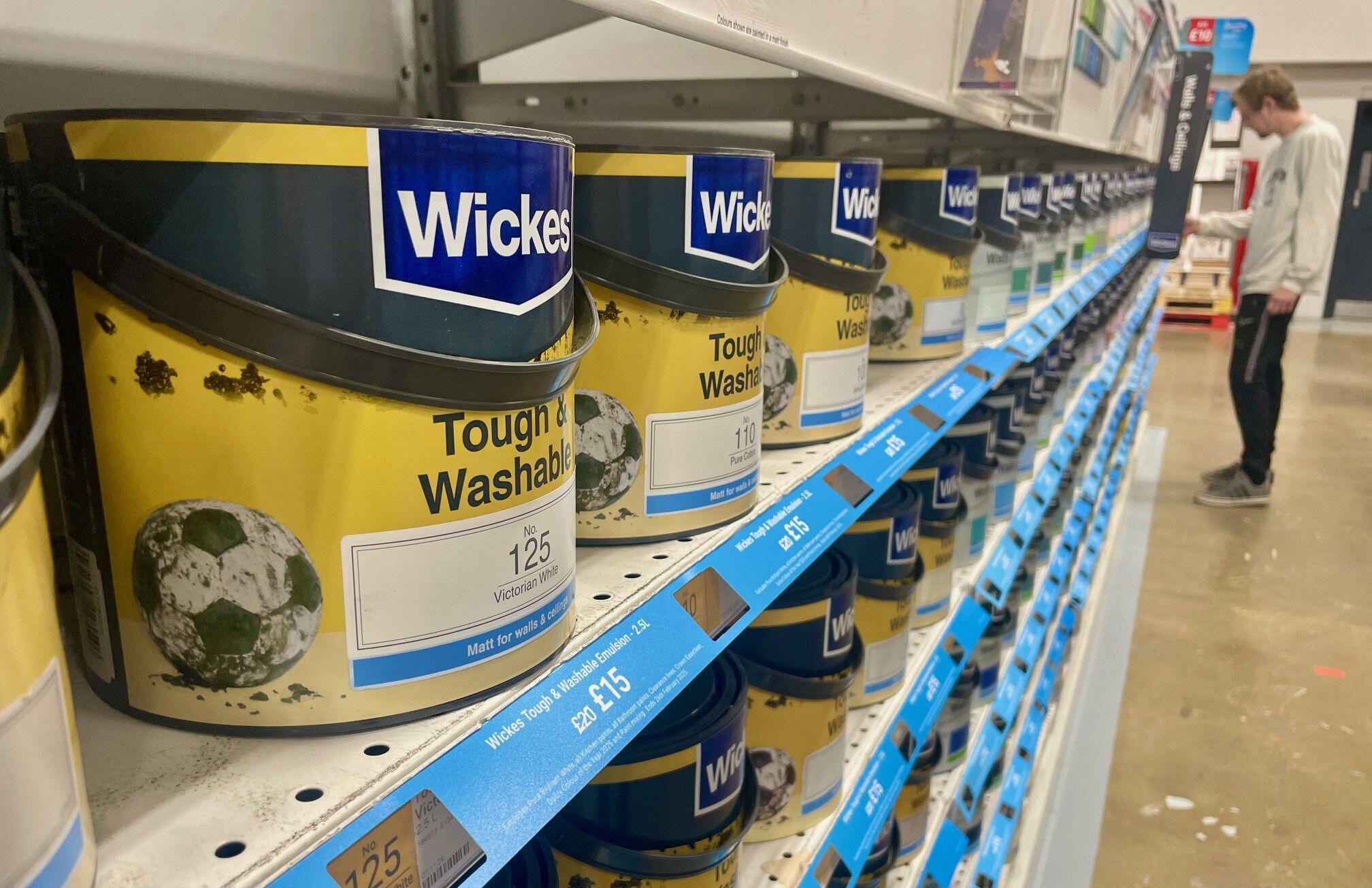 Shelves of Wickes Tough & Washable emulsion paint in a store.