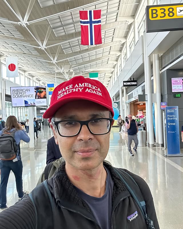 Selfie of Dr. Aseem Malhotra at an airport wearing a "Make America Healthy Again" hat.