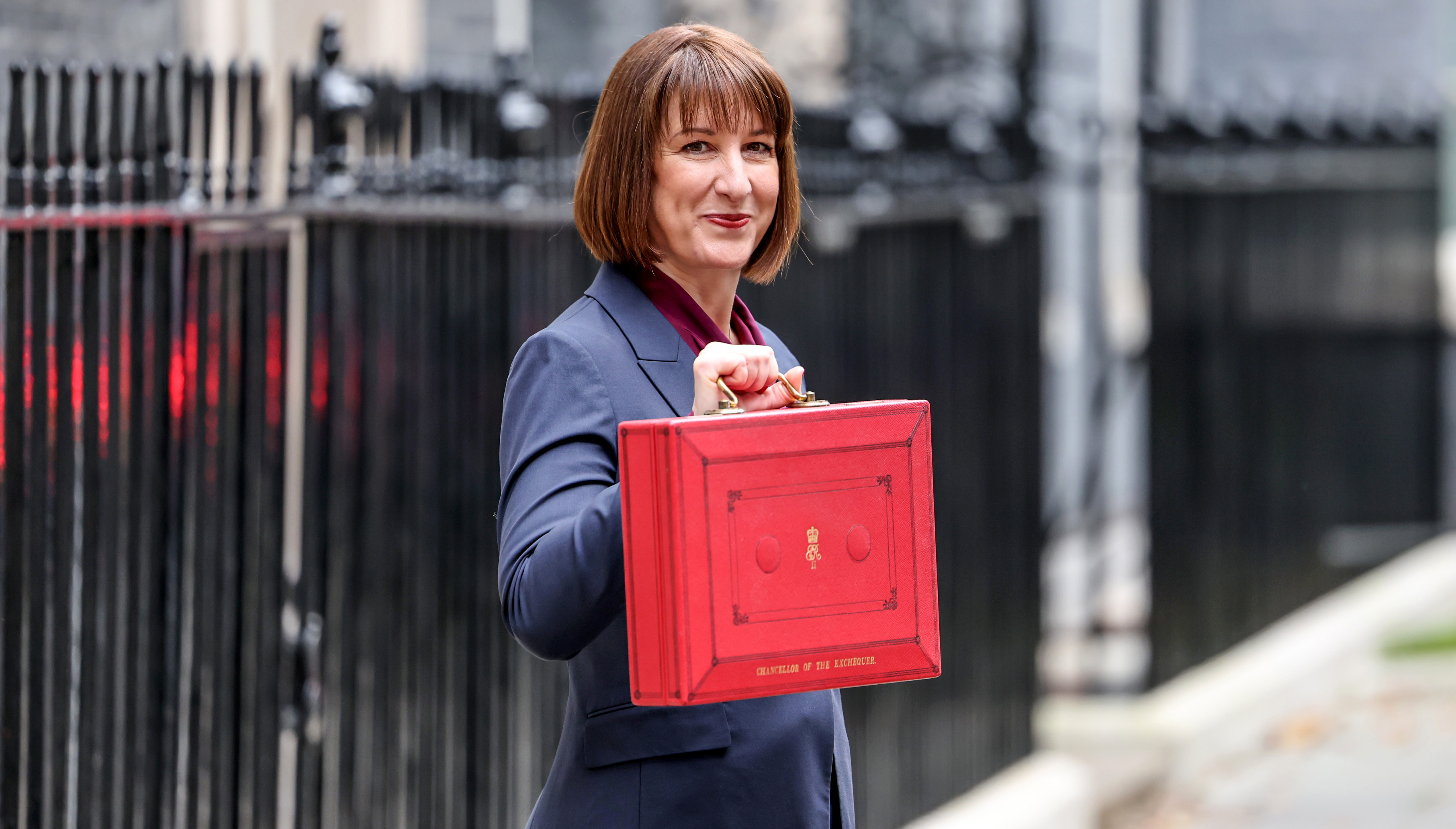 Chancellor Rachel Reeves holding the red budget box.