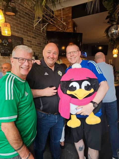Phil Bartlett (holding Penguin Tilman) wih Conrad Kirkwood, President of the IFA 