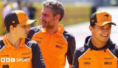 Oscar Piastri and Lando Norris having a conversation after the Italian Grand Prix, with McLaren team boss Andrea Stella stood behind them