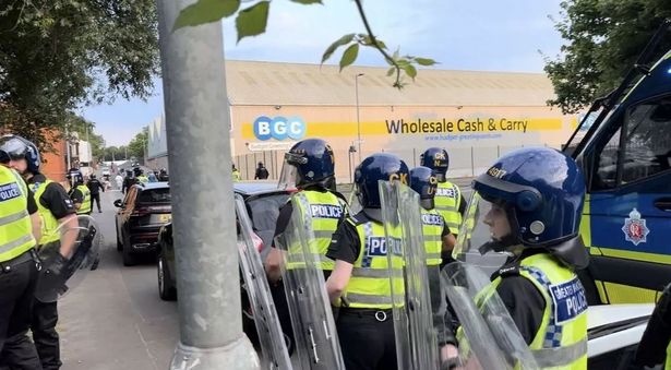 Riot police were attacked outside an asylum seeker hotel in Newton Heath last summer